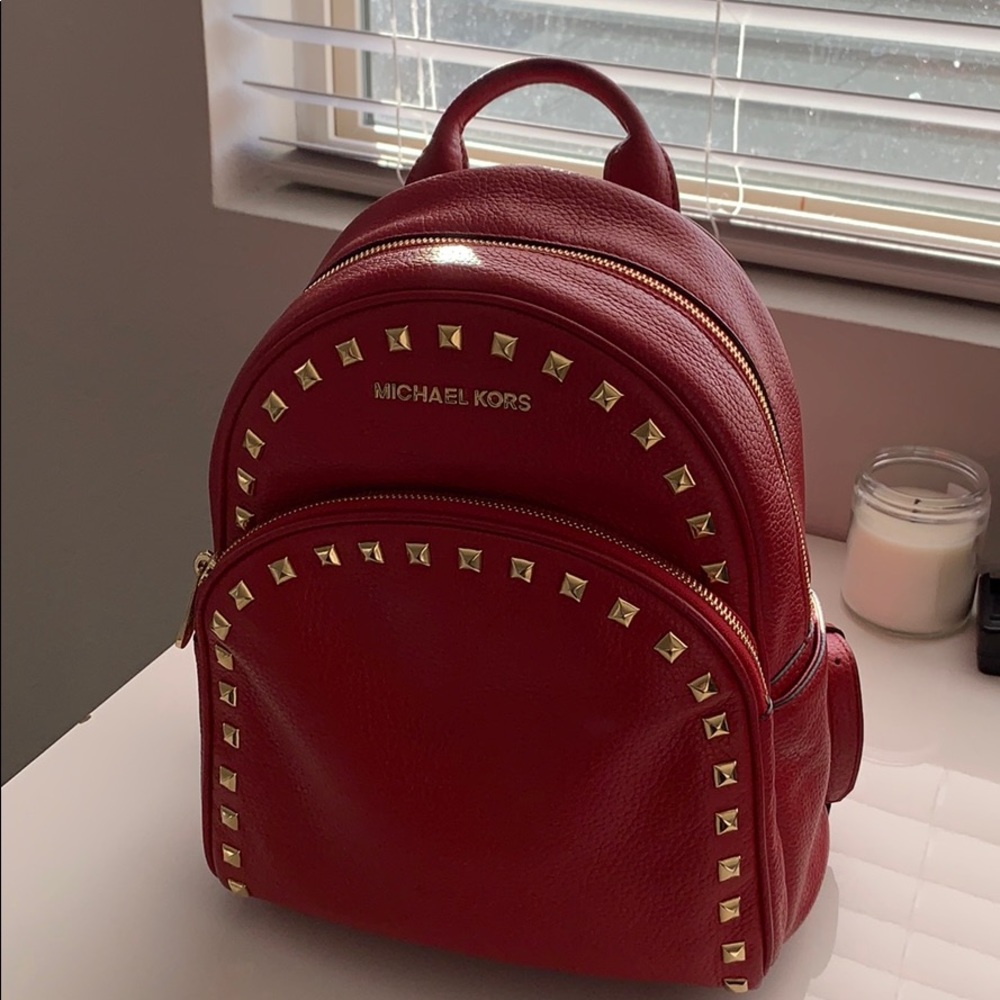 Red studded Michael kors backpack
